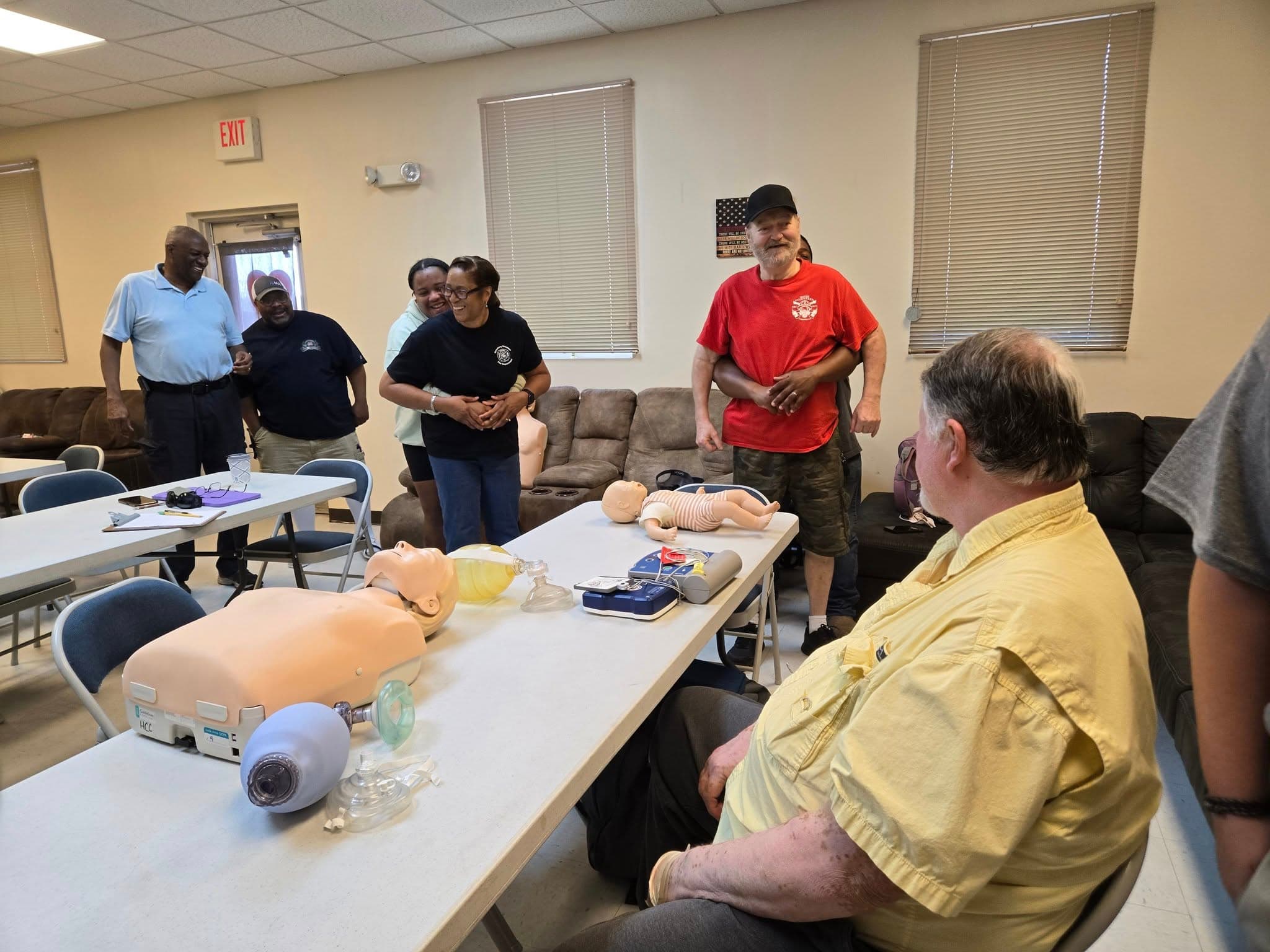 Garysburg volunteers practicing first responder support with CPR training equipment